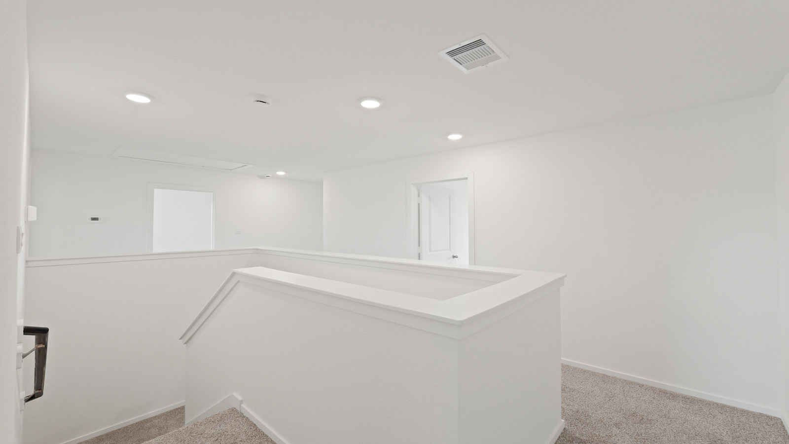Secondary bedroom with shag carpet flooring and bright window