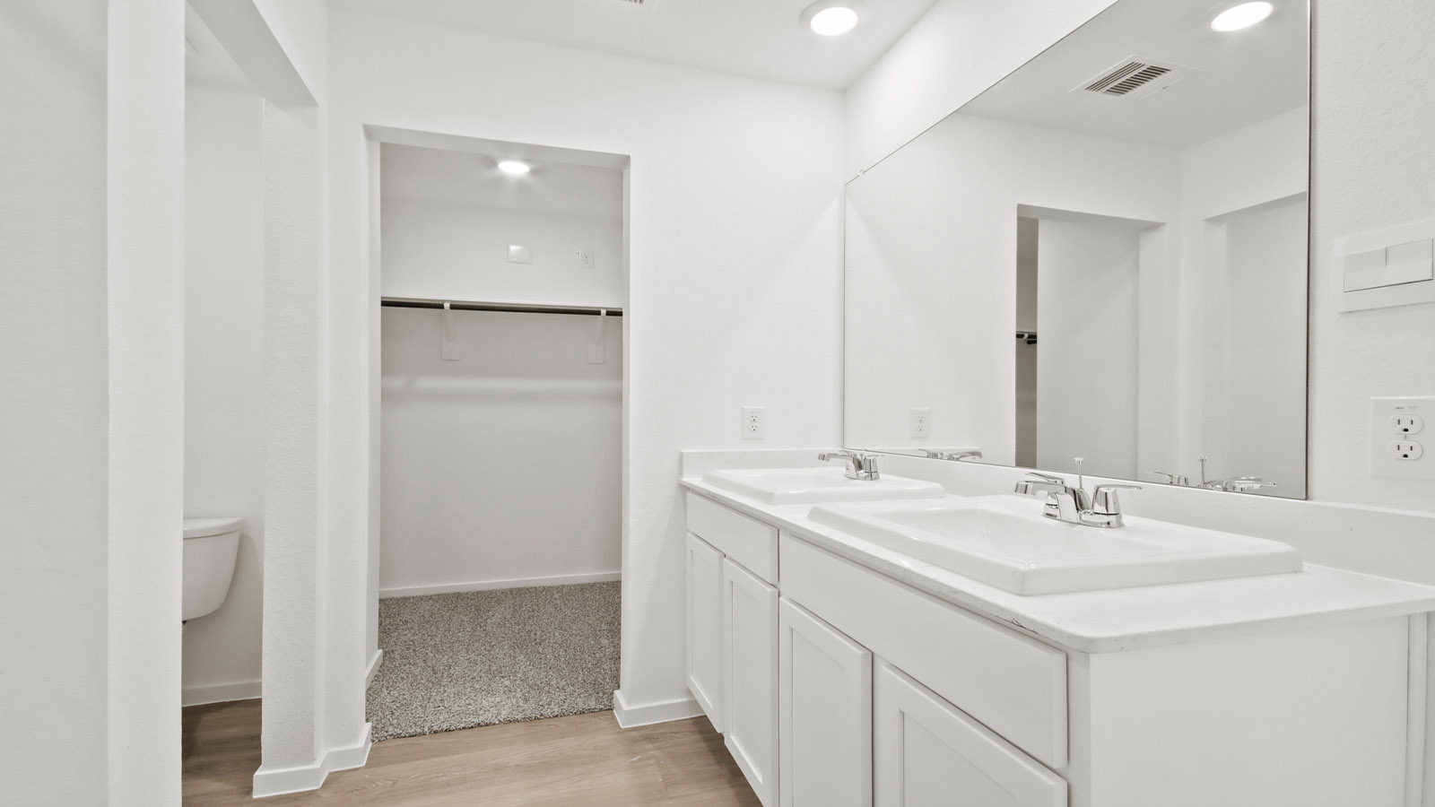 Primary bathroom with double sinks with quartz counter tops in Willis TX