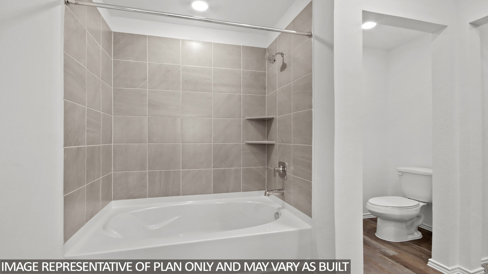 Secondary bathroom with a shower and tub combo, white walls, and vinyl wood flooring.