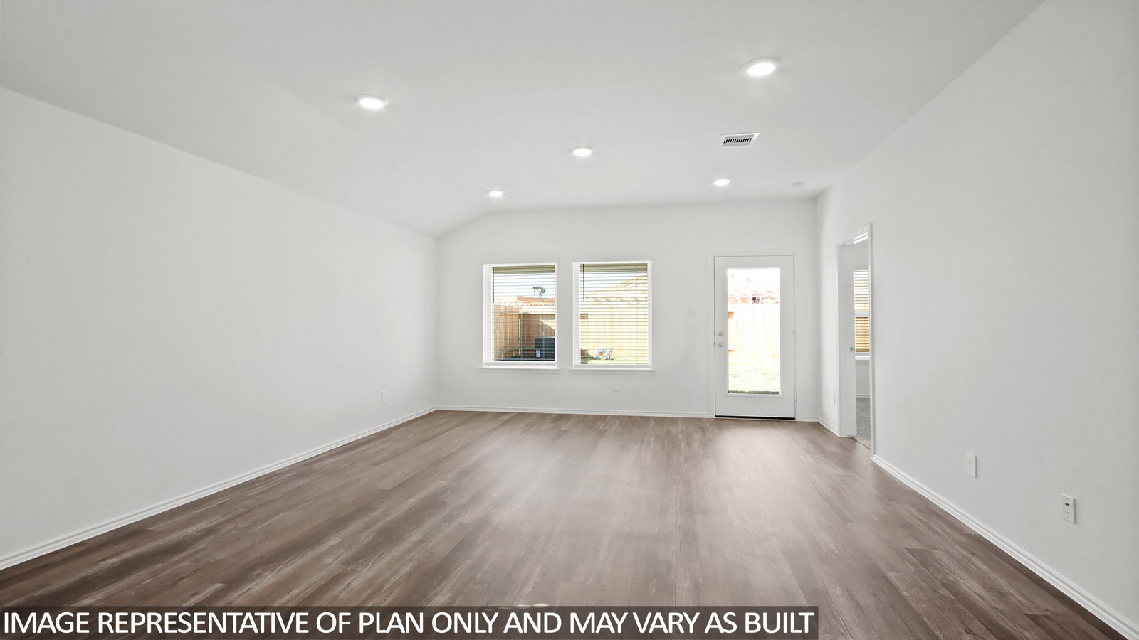 Open living room with windows, white walls, and vinyl wood flooring.