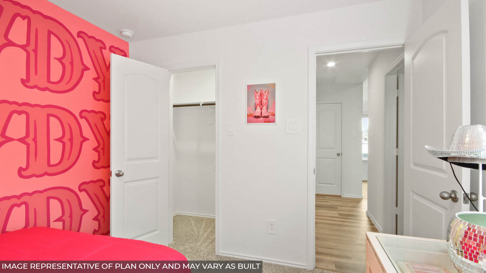 Secondary bedroom with windows, white walls, and light carpet.