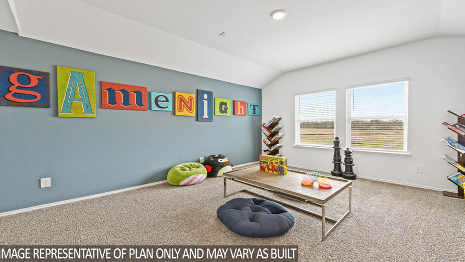 Second story game room with carpet flooring with bright windows in this multi functional space in Willis TX