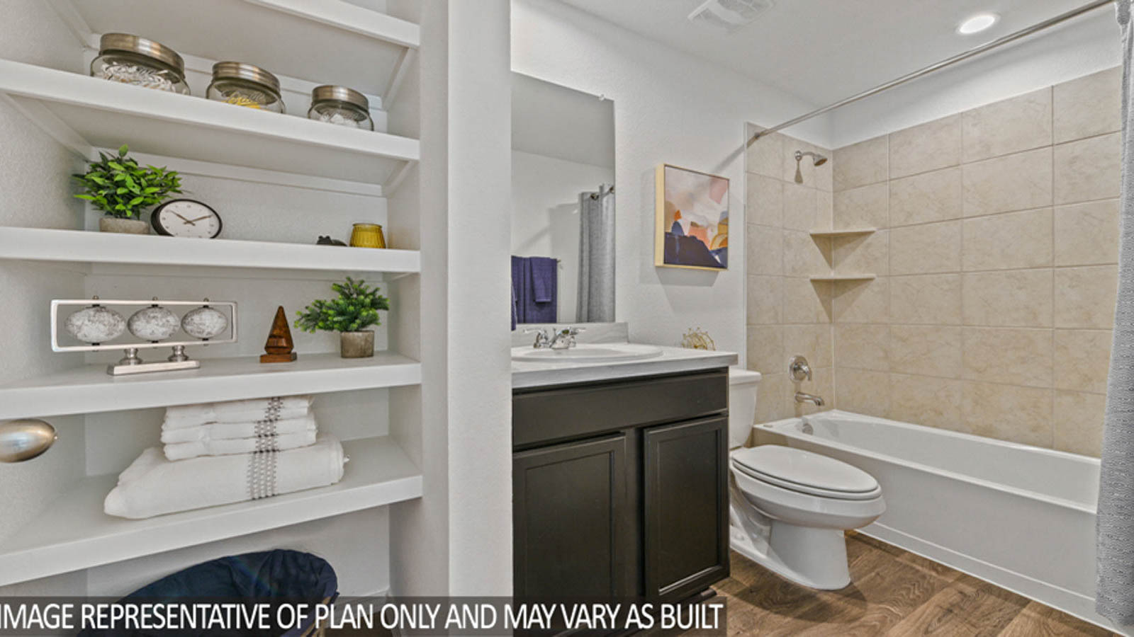 Secodnary bathroom with a shower and tub combo, white walls, and vinyl wood flooring.