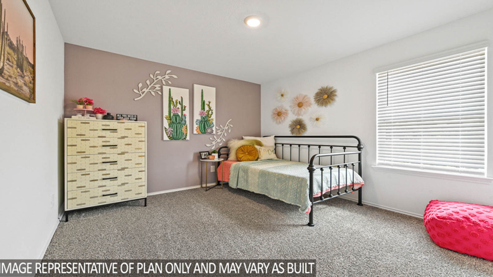 Secondary bedroom with windows, white walls, and light carpet.