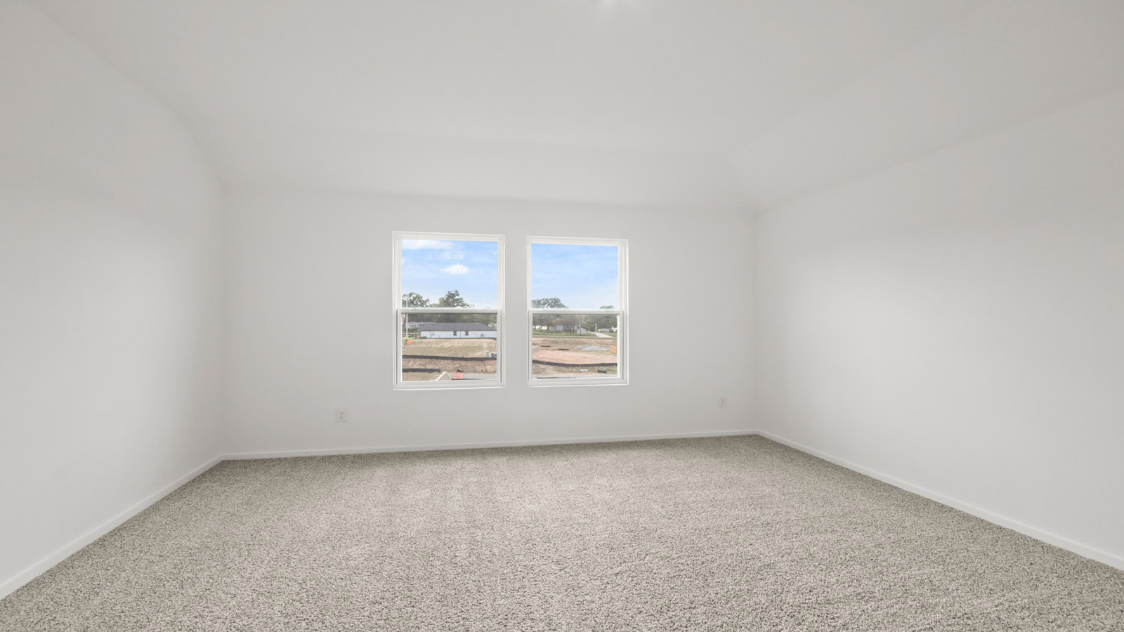 Primary bedroom with carpet flooring