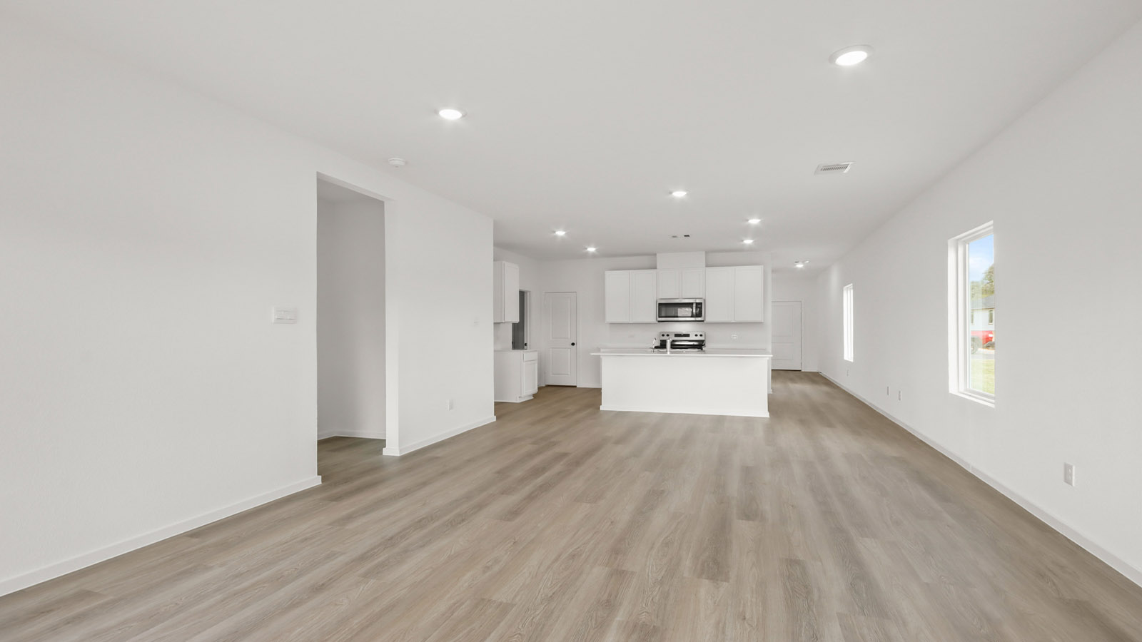 Open concept living, dining, and kitchen area