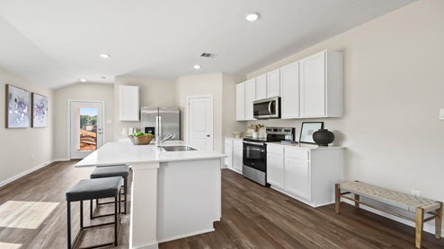 open concept living room with vinyl flooring and large windows