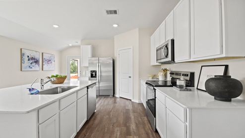 kitchen with quartz countertops and stainless steel appliances