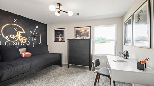 primary bedroom with large windows and carpet flooring
