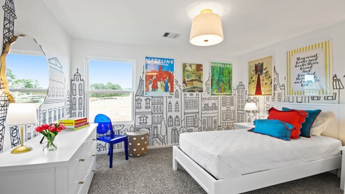 primary bedroom with large windows and carpet flooring