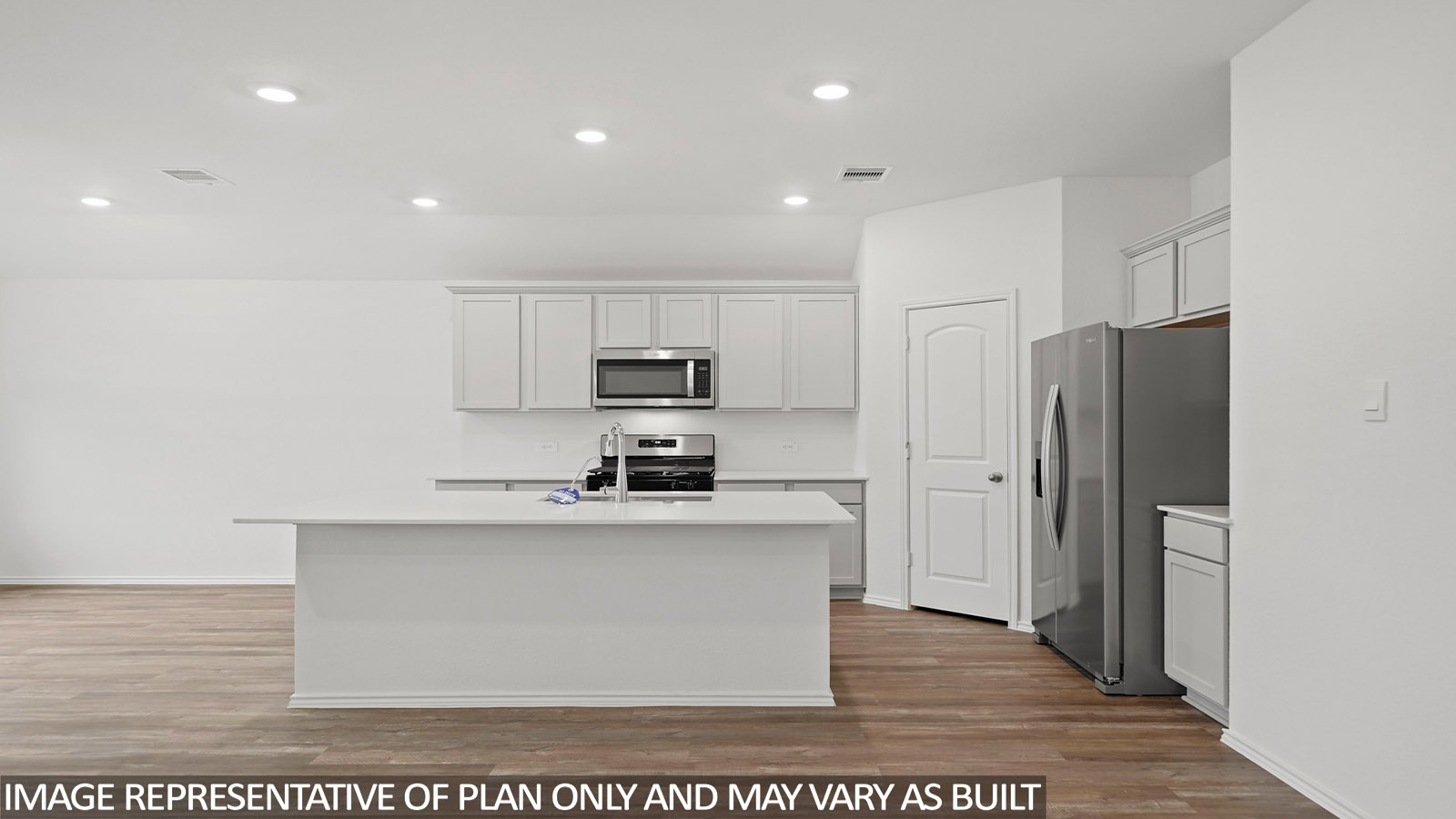 Open kitchen with an island, stainless steel appliances, white cabinets, white walls, and vinyl wood flooring.