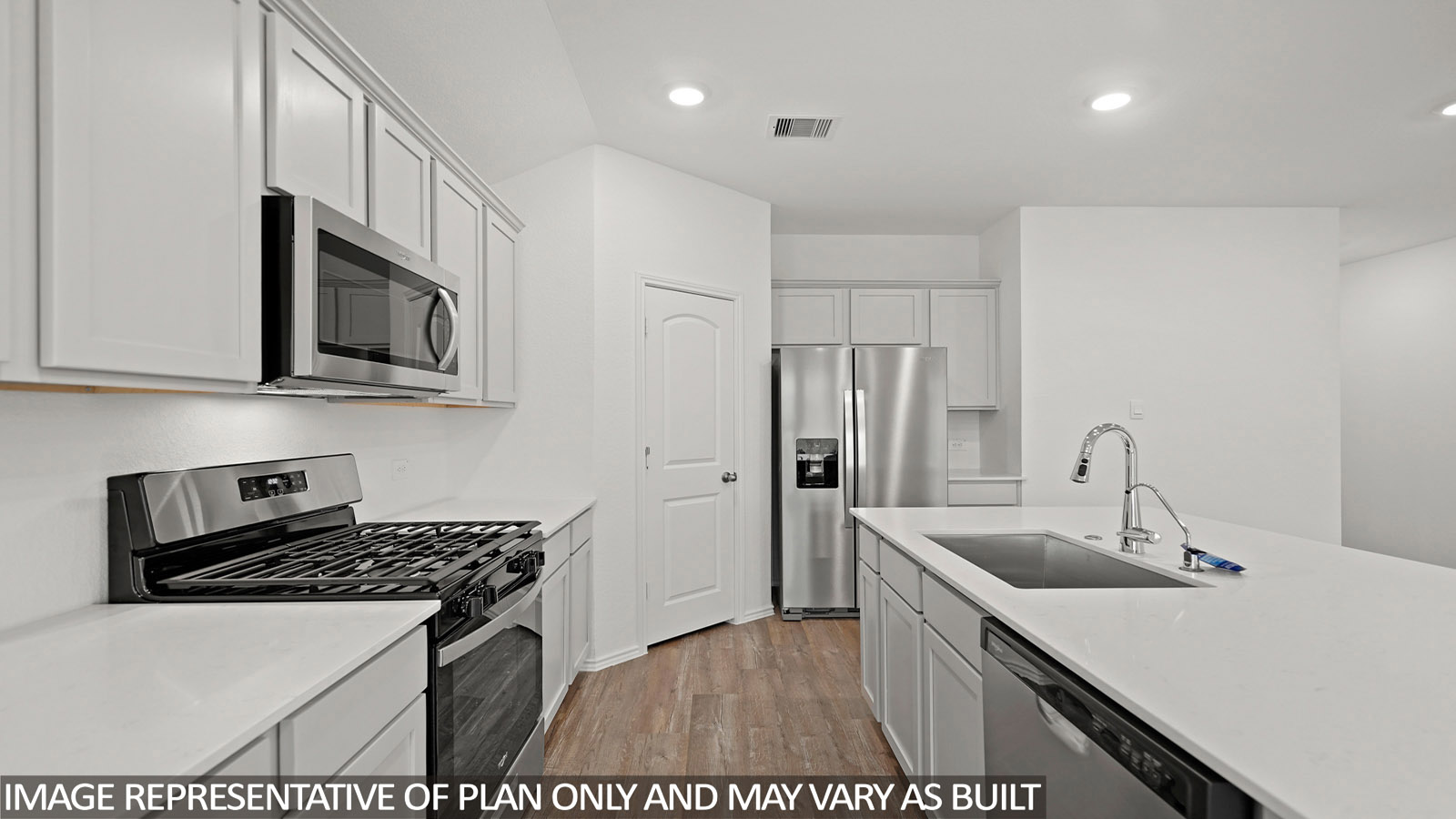 Open kitchen with an island, stainless steel appliances, white cabinets, white walls, and vinyl wood flooring.