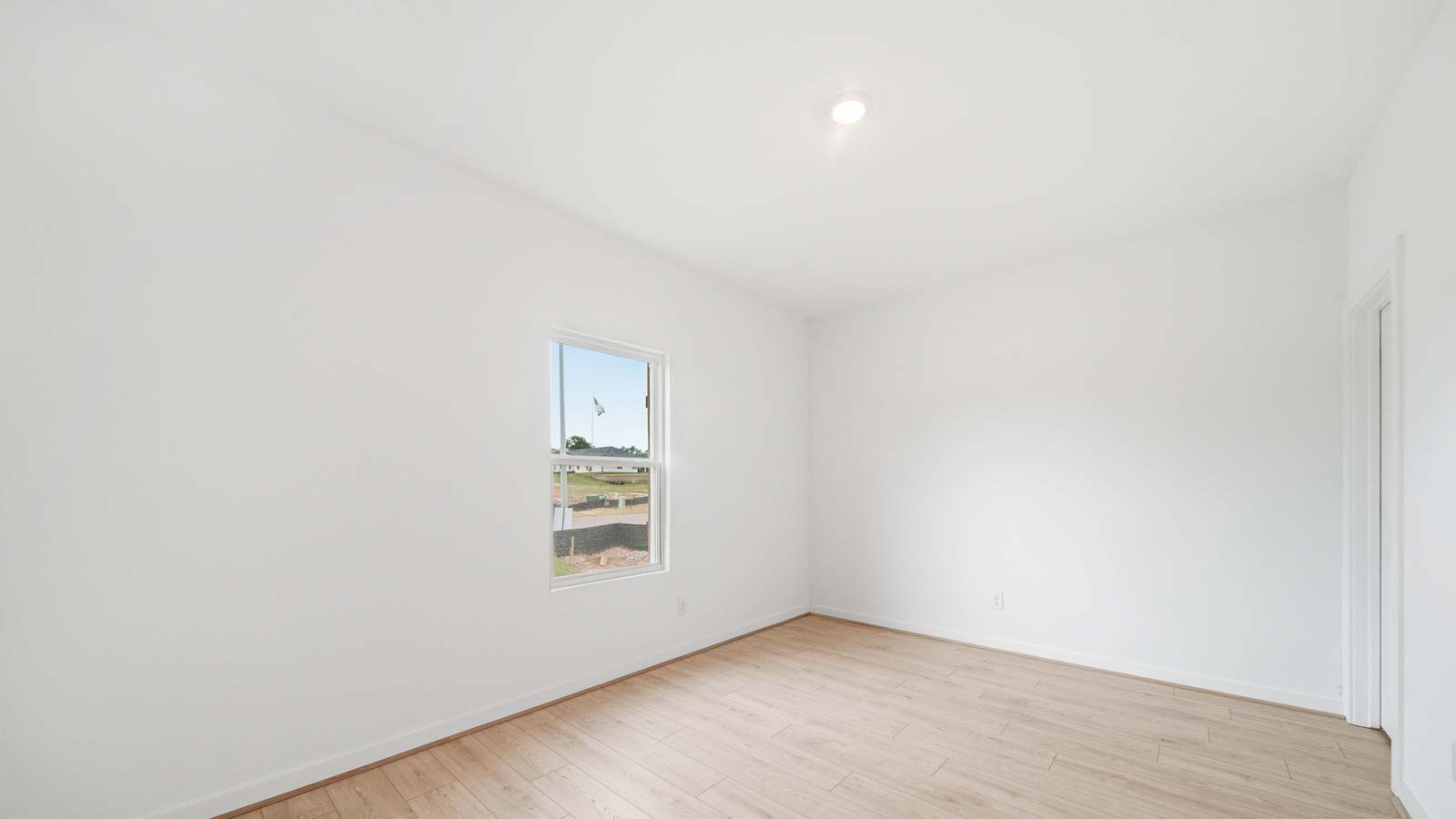 Primary bedroom with vinyl  flooring