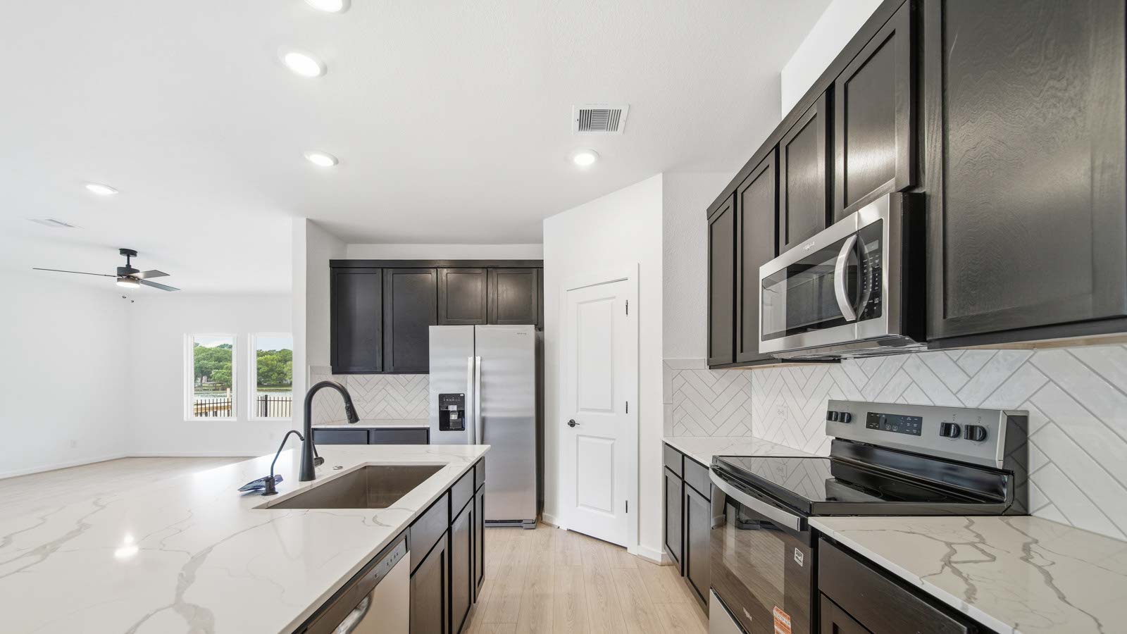 Kitchen with an island and vinyl floor