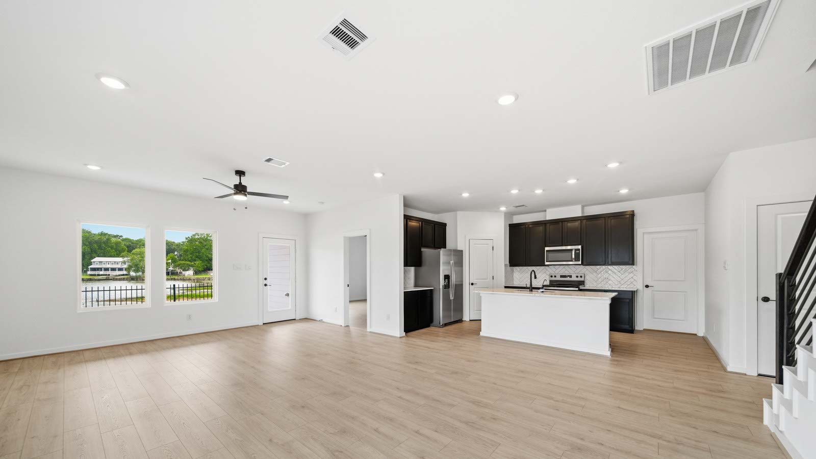 Kitchen with an island and vinyl floor
