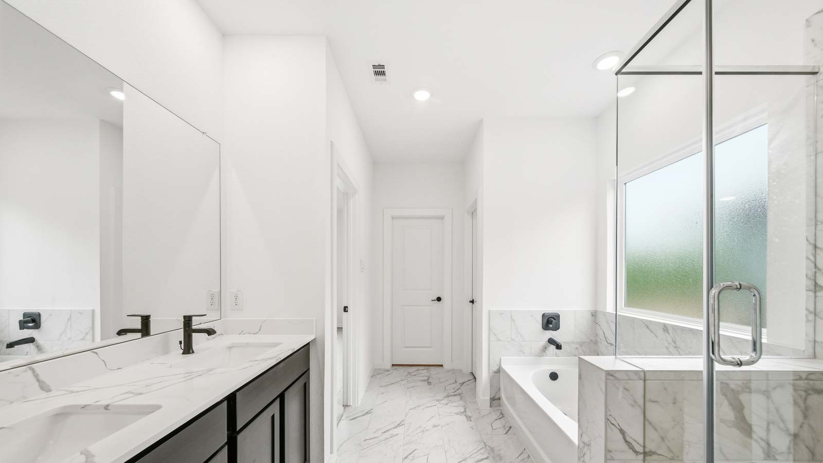 Primary bathroom with tub and shower