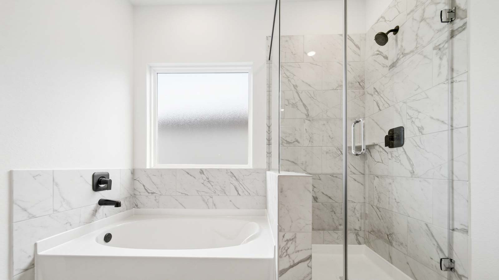 Primary bathroom with tub and shower