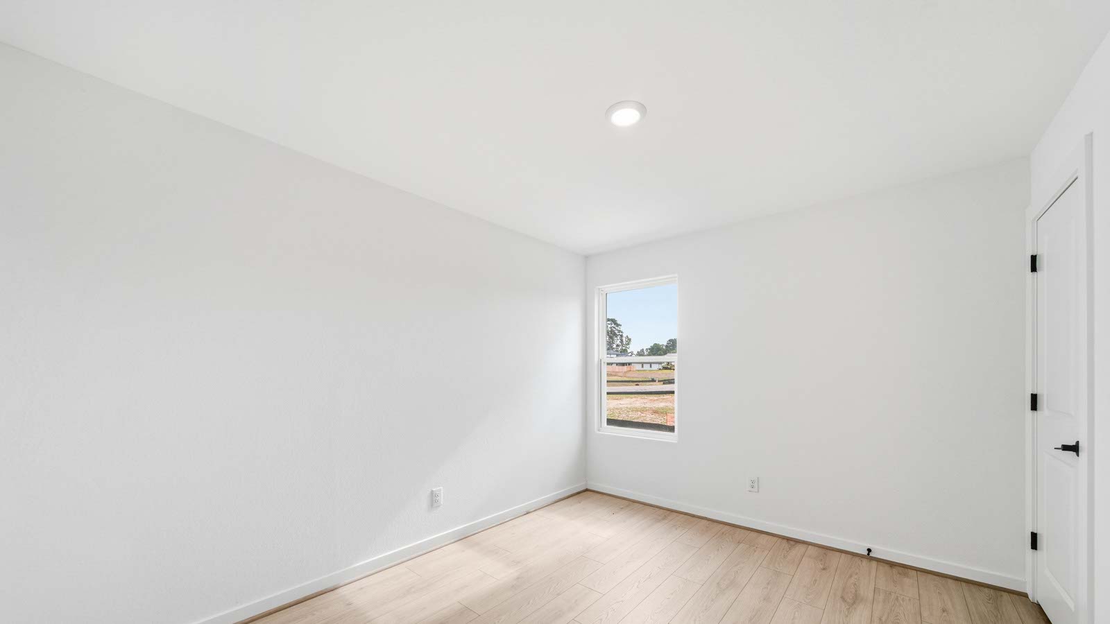 Secondary bedroom with vinyl flooring