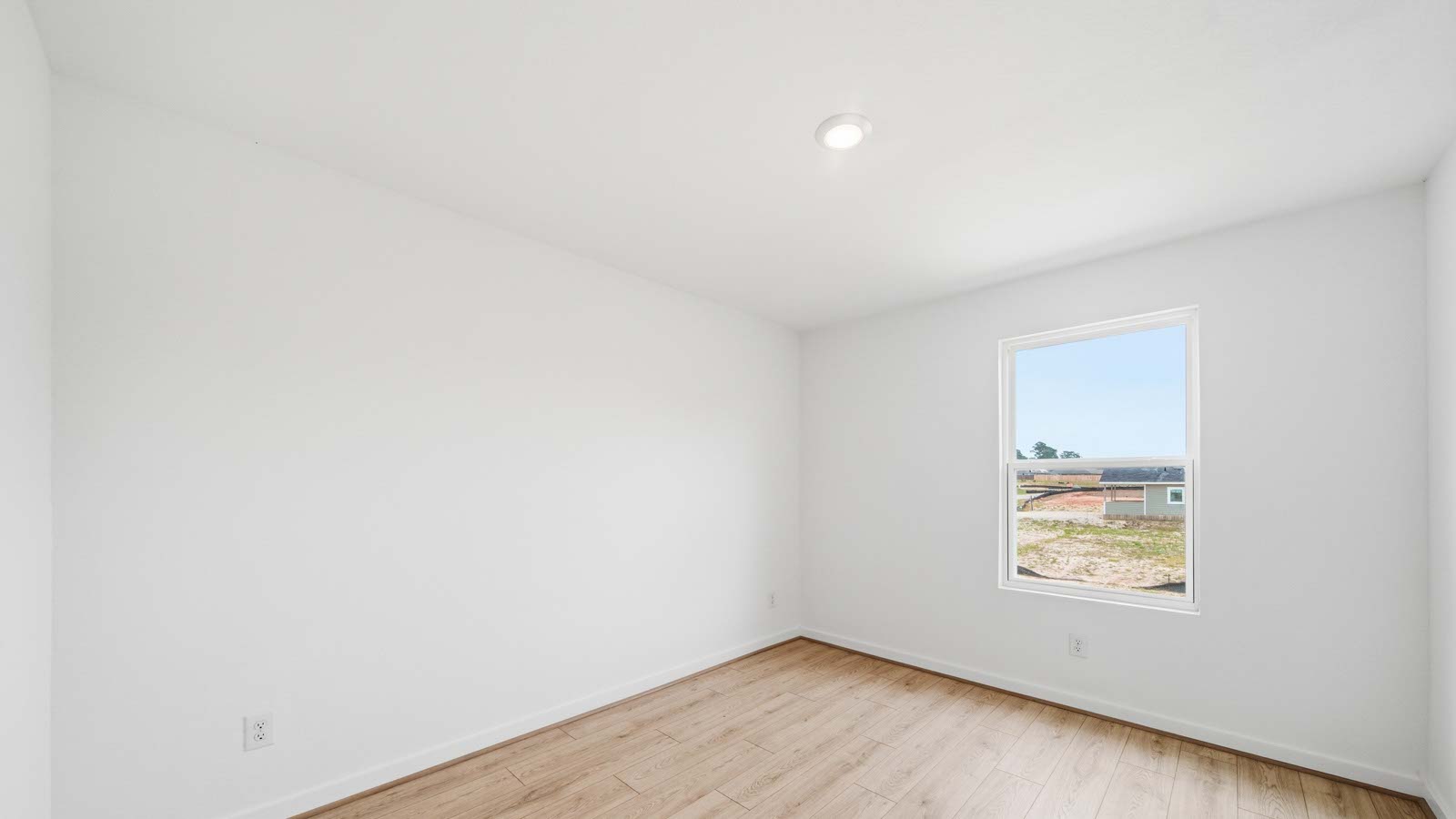 Secondary bedroom with vinyl flooring