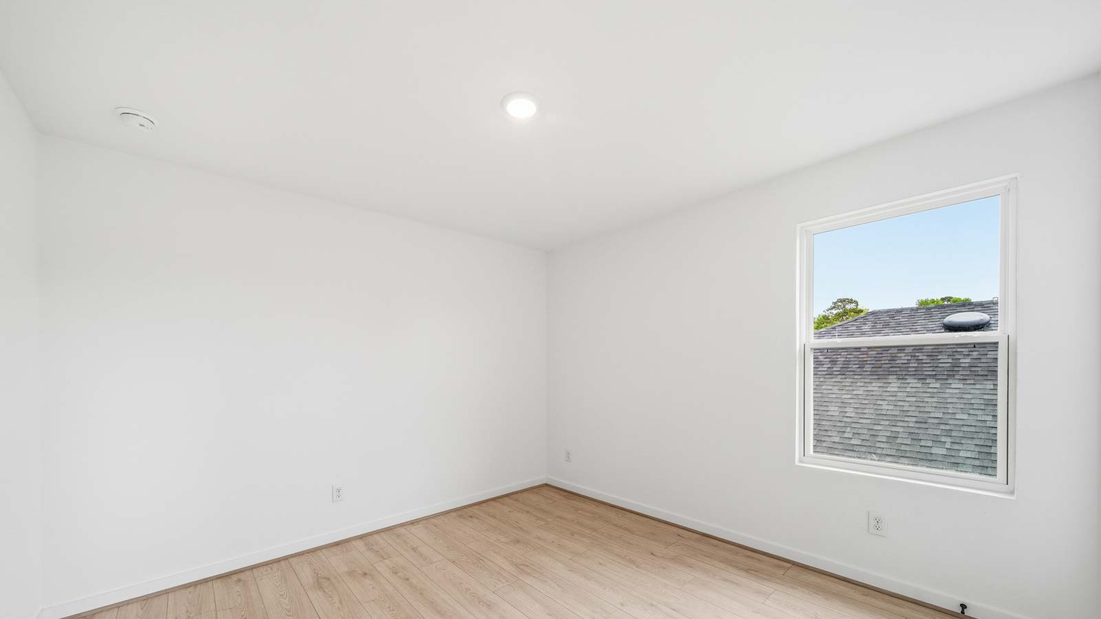 Secondary bedroom with vinyl flooring