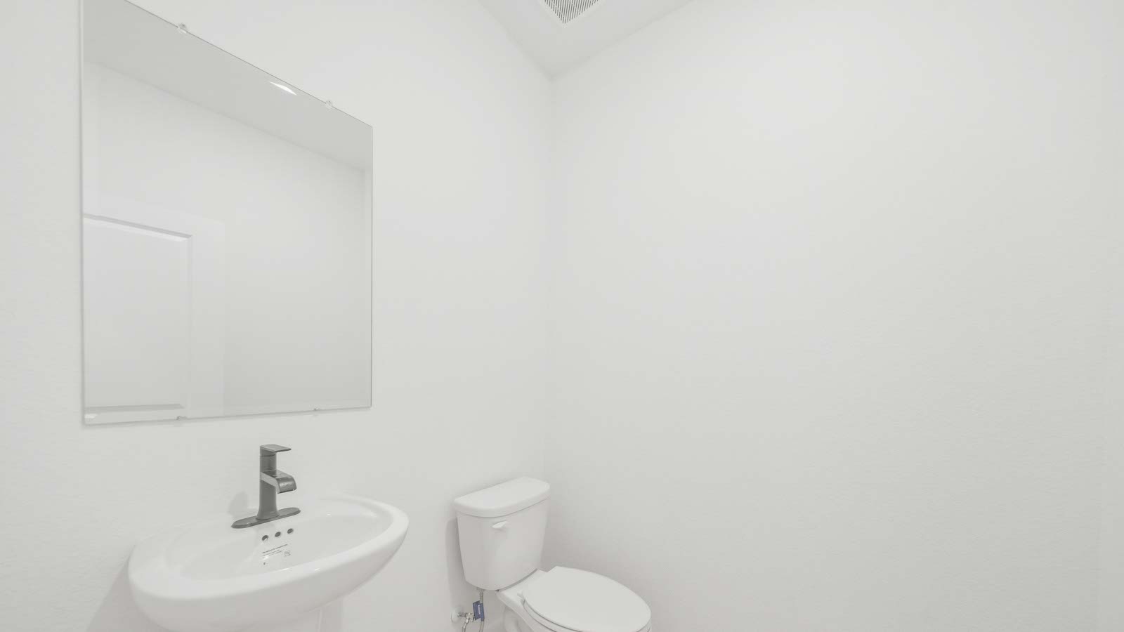 Powder bathroom with pedestal sink