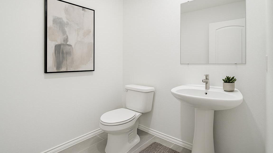 Powder room with white walls and vinyl wood flooring.