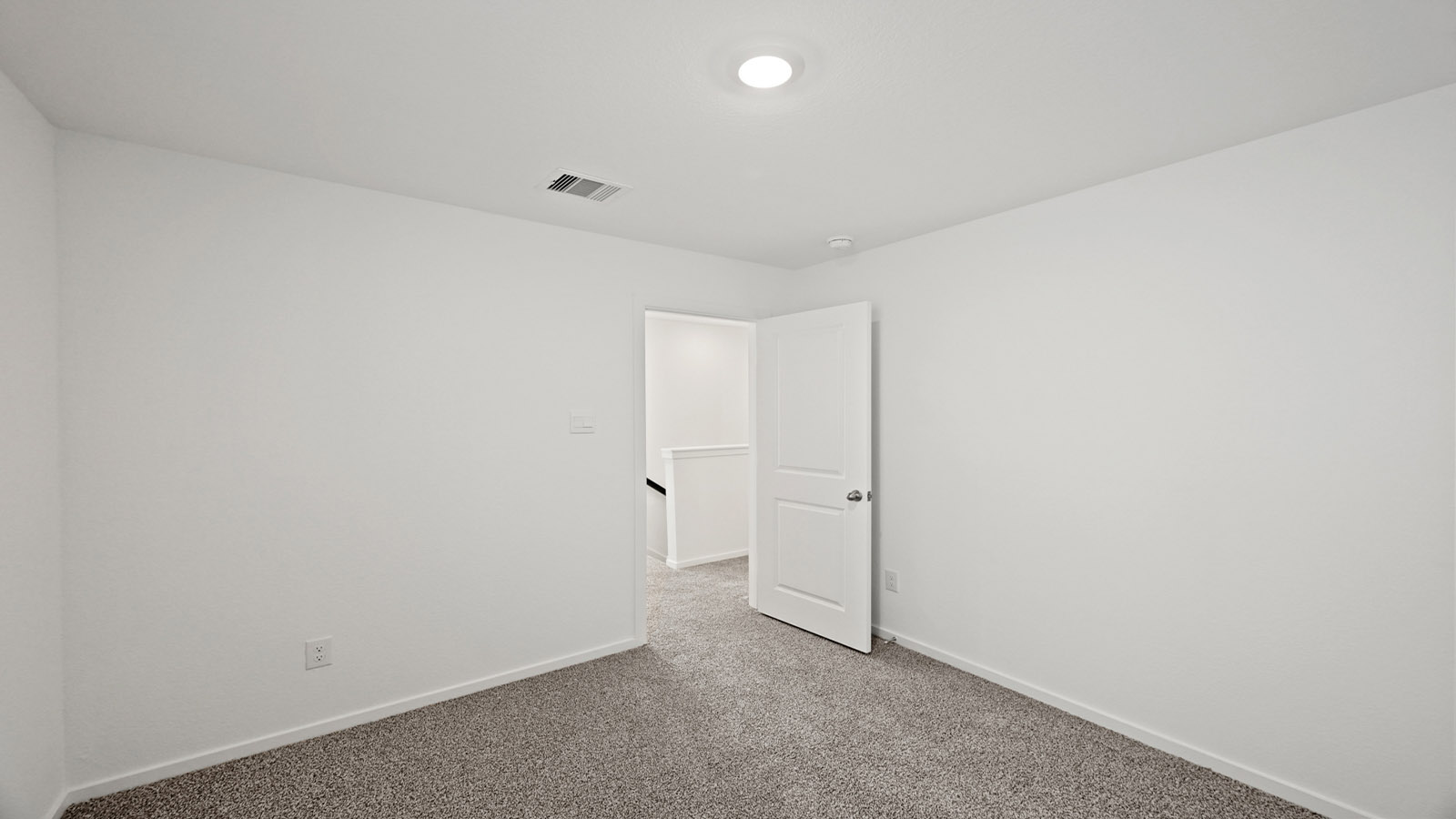 secondary bedroom with carpet flooring