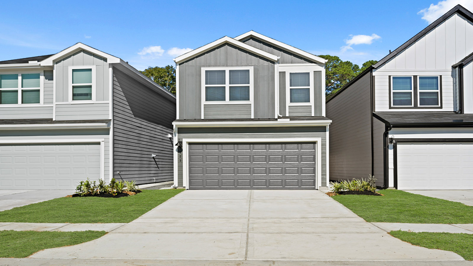 two story home with two car garage