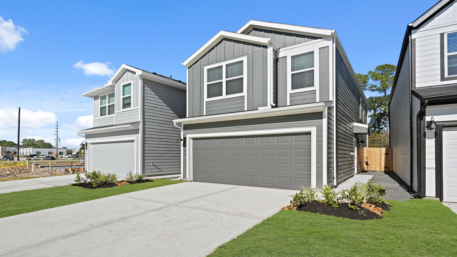 two story home with two car garage