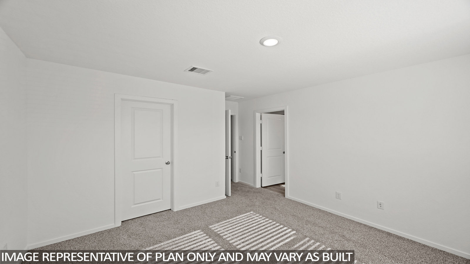 Primary bedroom with carpet flooring