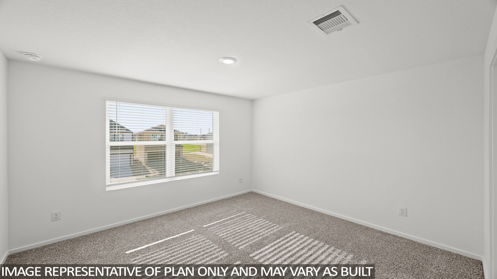 Primary bedroom with carpet flooring