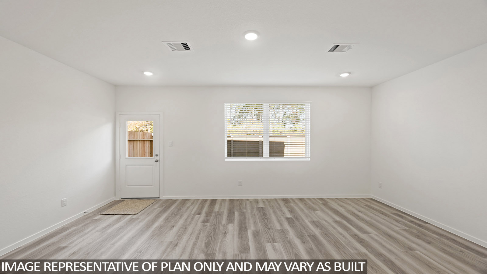 Spacious living area with vinyl flooring
