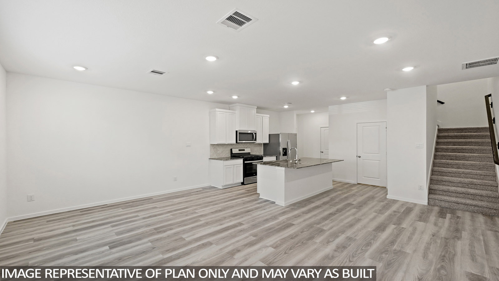 Open concept living, dining, and kitchen area