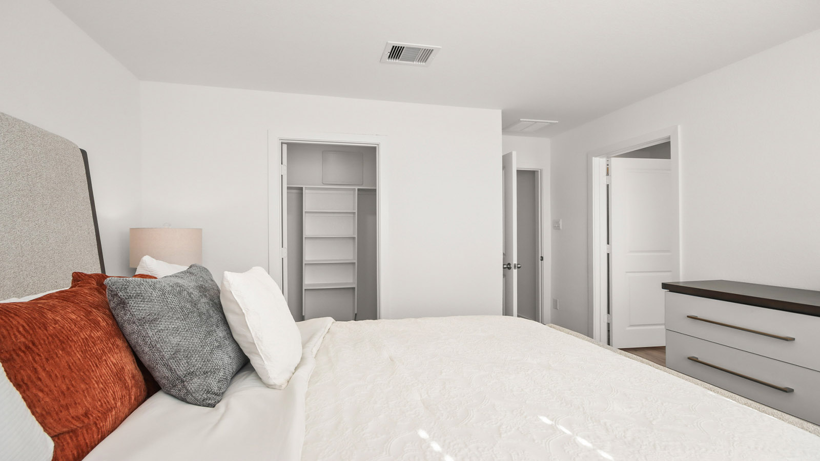 Primary bedroom with bright windows