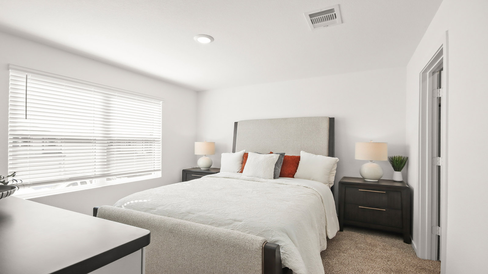 Primary bedroom with carpet flooring