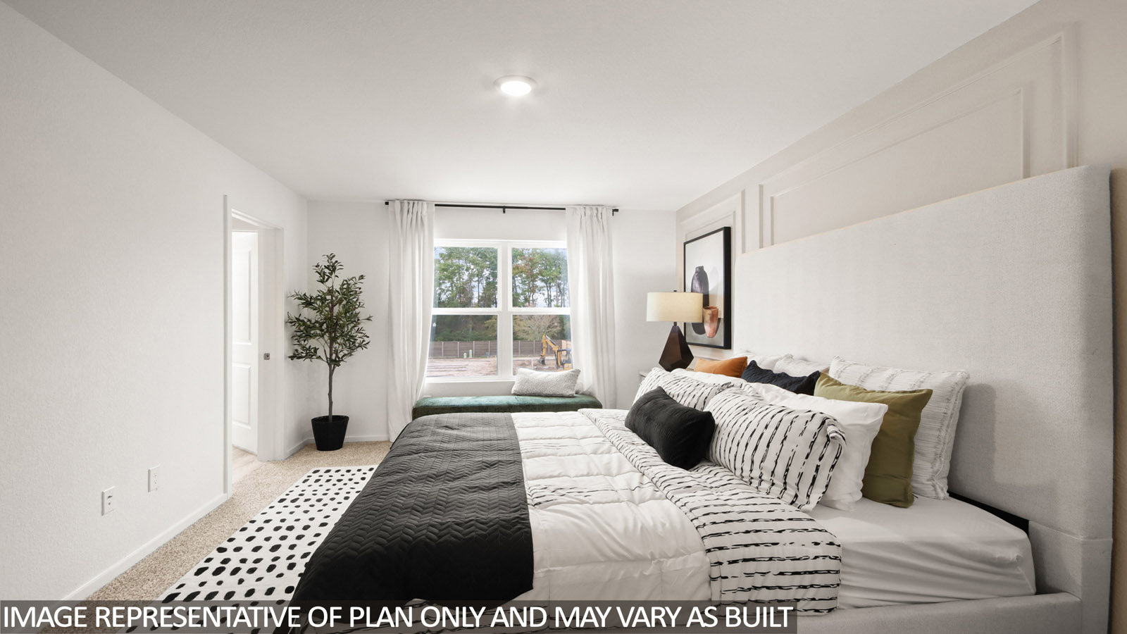 Primary bedroom with carpet flooring
