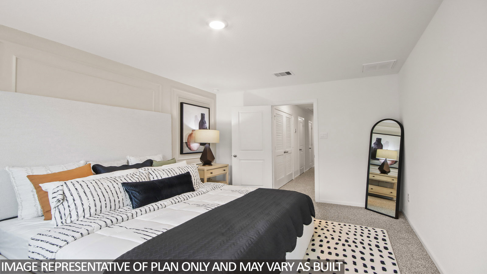 Primary bedroom with carpet flooring