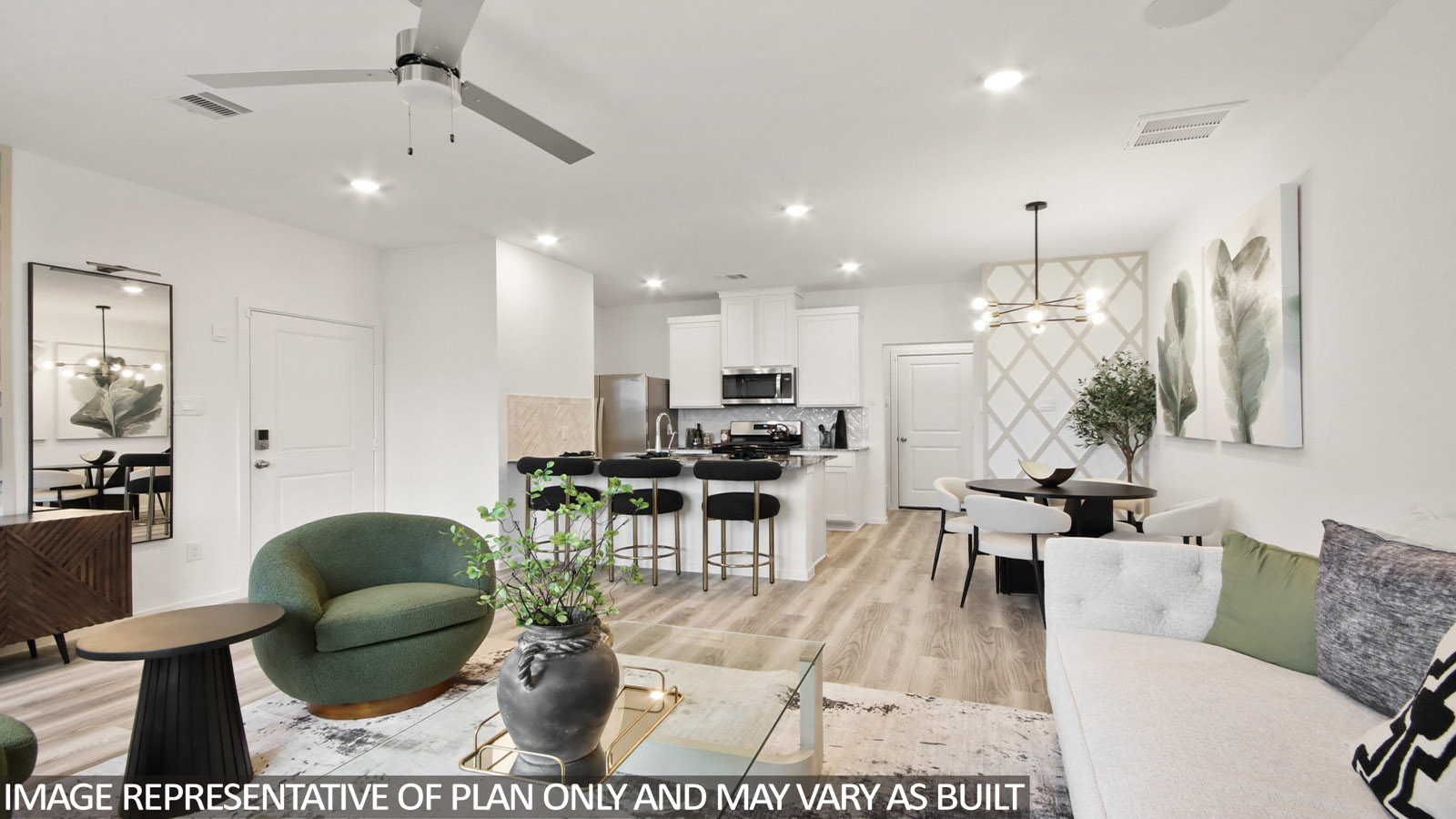 Spacious living area with vinyl flooring