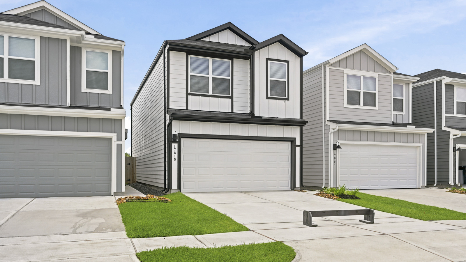two story home with two car garage