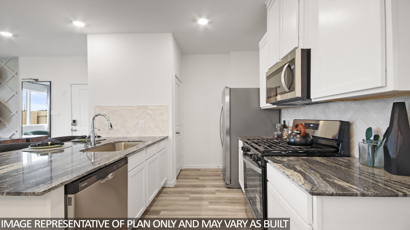 Kitchen with an island and vinyl floor
