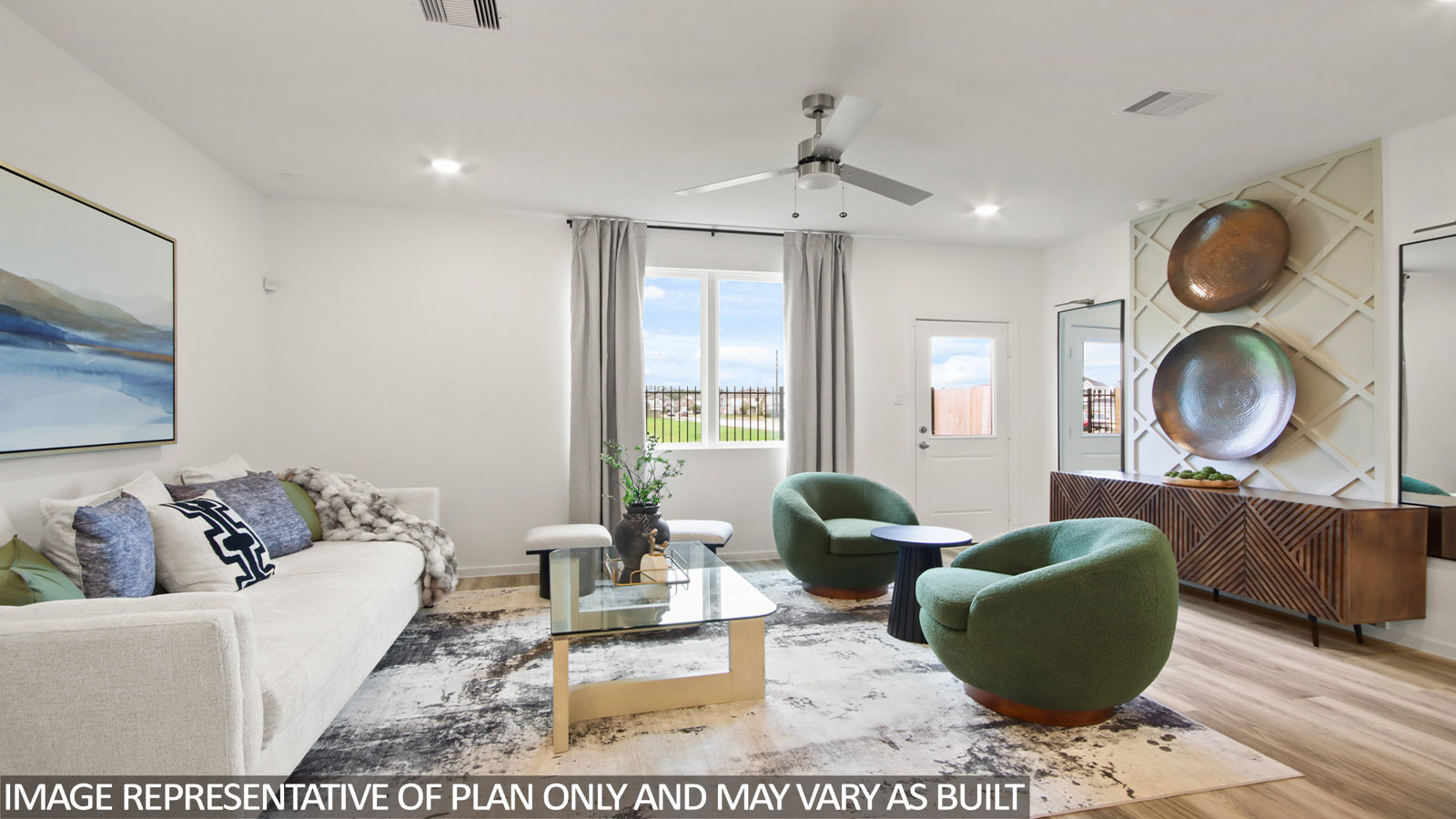 Spacious living area with vinyl flooring