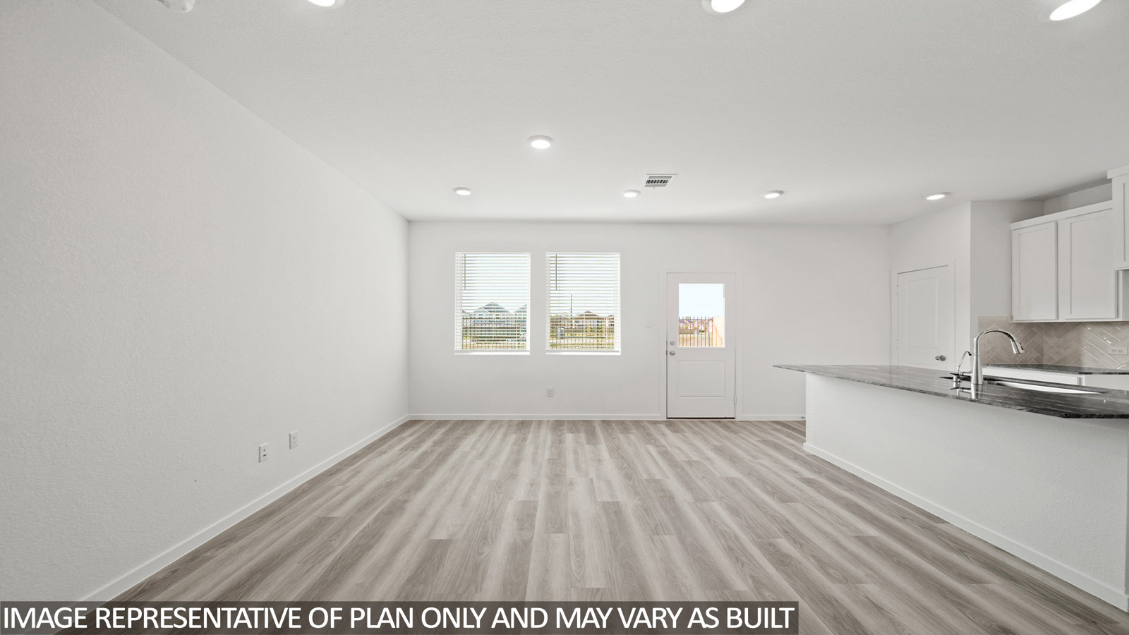 Open concept living, dining, and kitchen area
