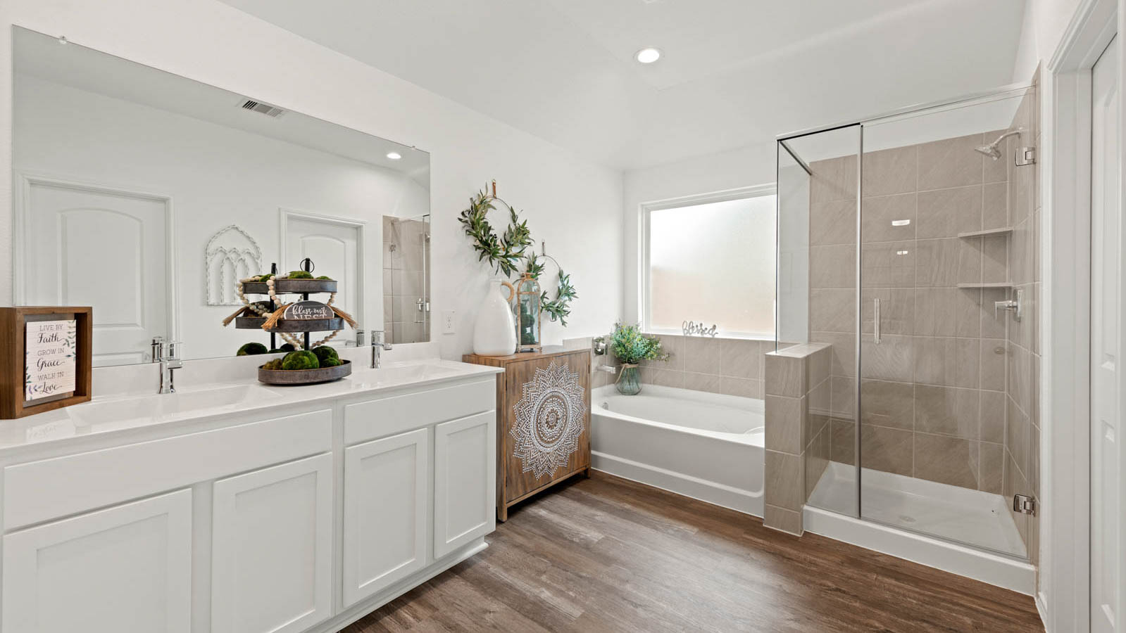 primary bathroom with tub and shower