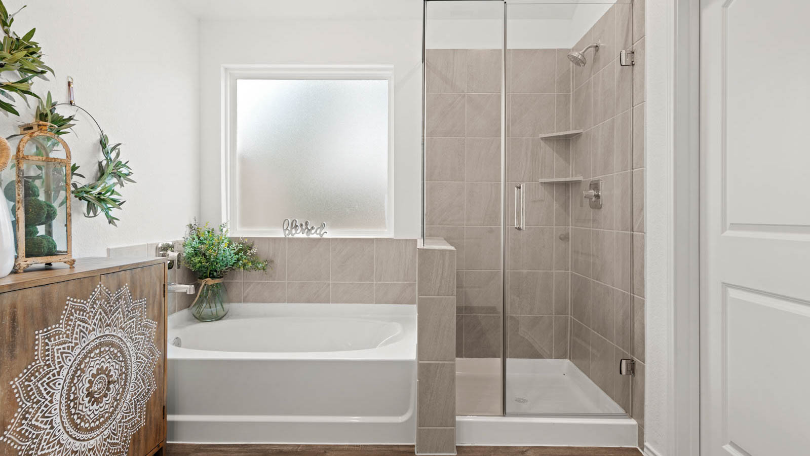 primary bathroom with tub and shower