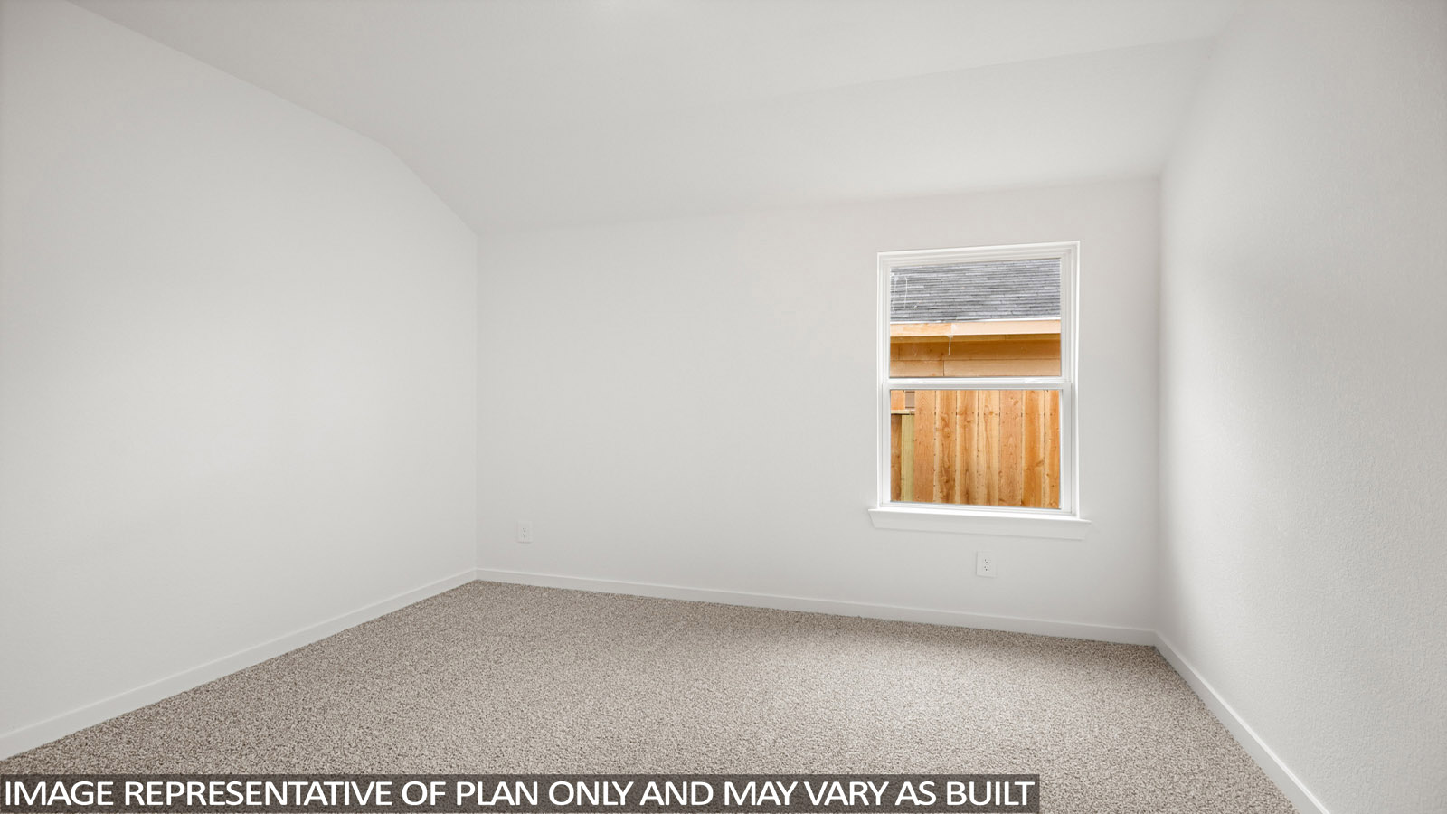 Secondary bedroom with carpet flooring