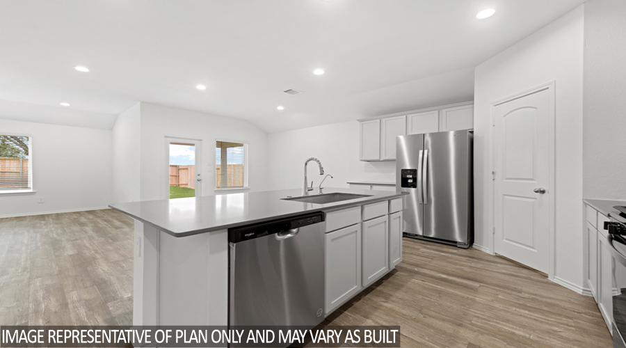 Kitchen with island and stainless-steel appliances.