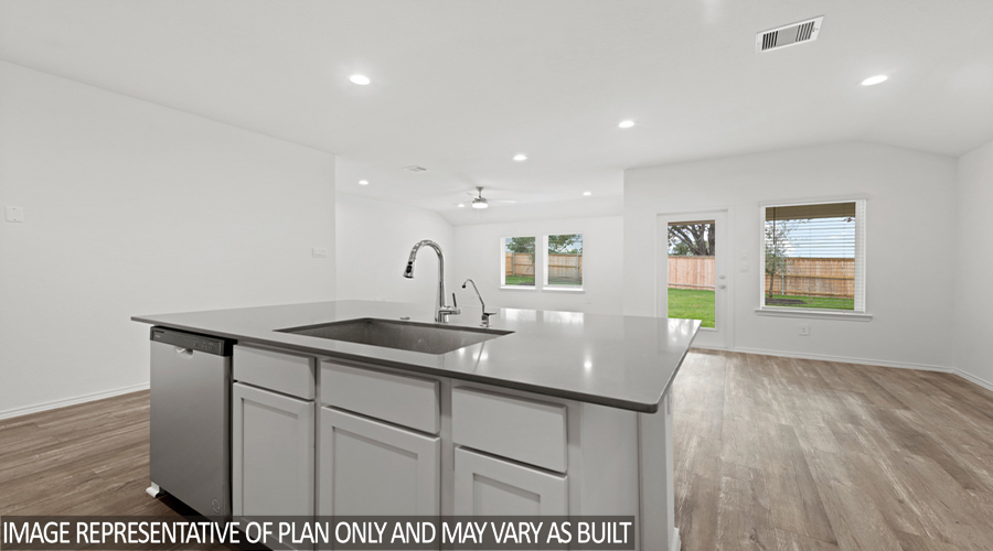 Kitchen with island and stainless-steel appliances.