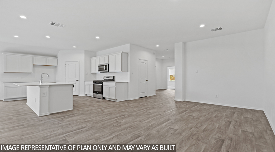 Kitchen with island and stainless-steel appliances.