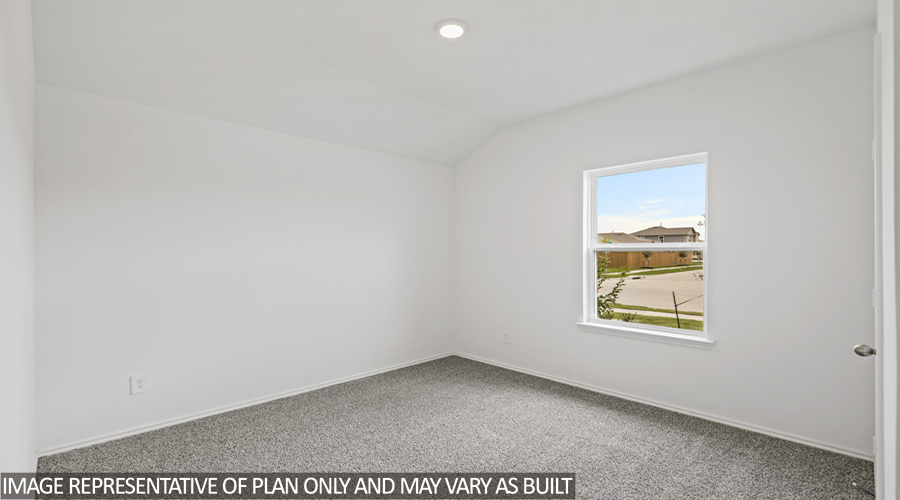 Secondary bedroom with carpet flooring and a bright window.