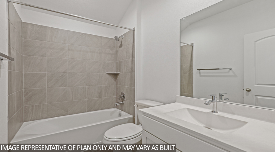 Secondary bathroom with tub/shower combo.